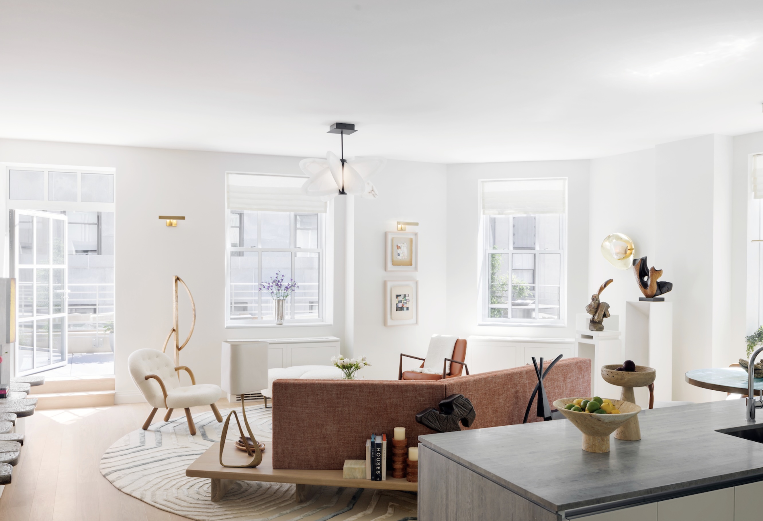 Sunlit NYC living room with curated art and design